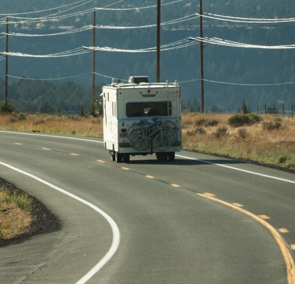 Solar equipped RV driving down highway